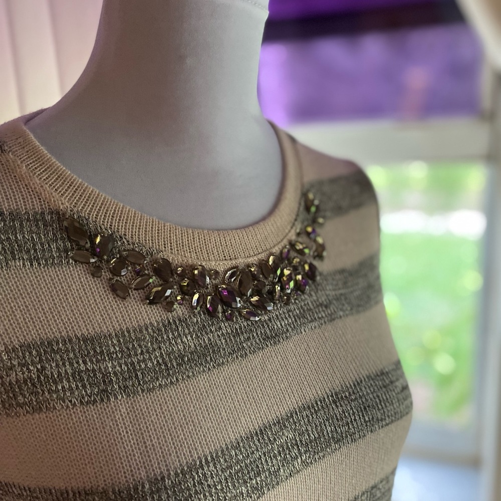Beautiful sweater with bling at the neck and faux shirttail hem